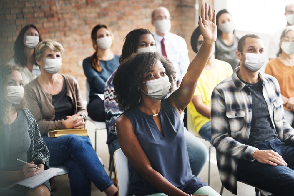 Photo of community members at a town hall meeting