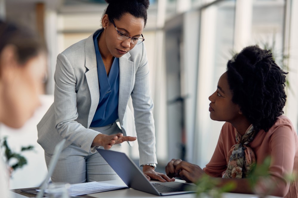 An image of people having a discussion in an office