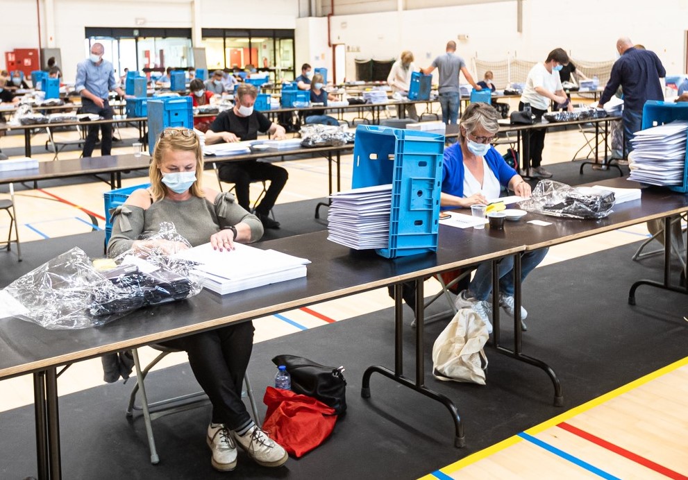 Local government employees in Bruges working on mask distribution