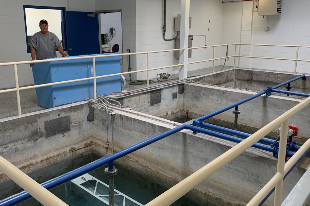 Water treatment plant employee oversees operations