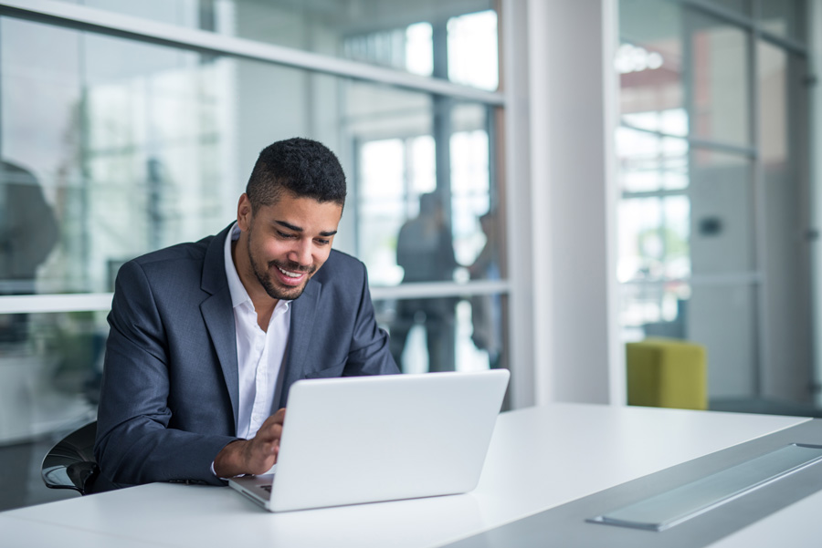 Black man working on a computer