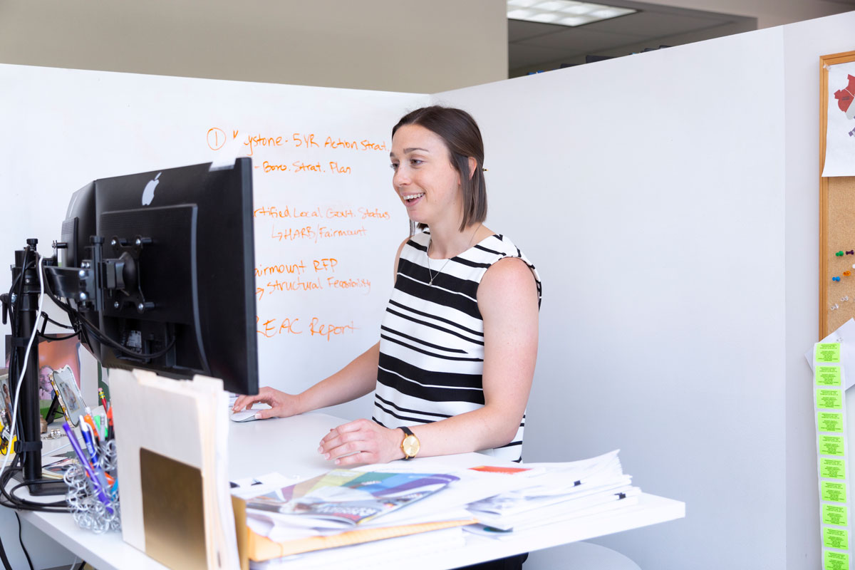 Photo of a woman in an office using a computer