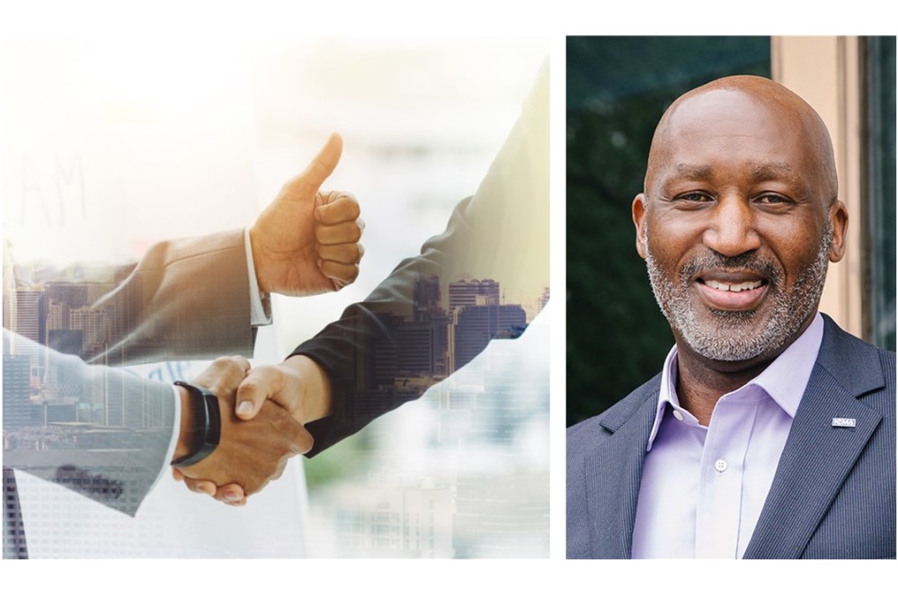 Image of Marc Ott with businesspeople shaking hands