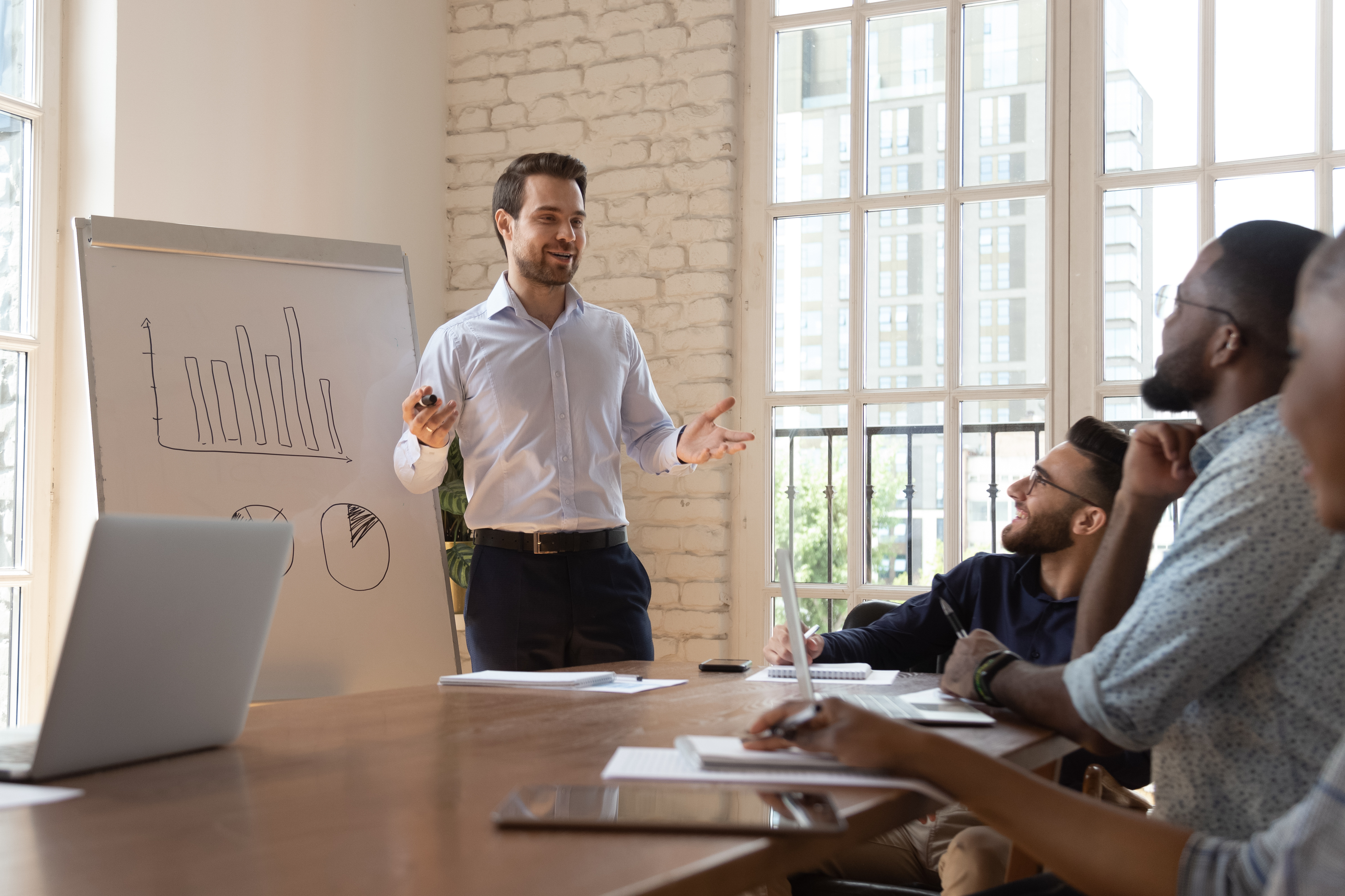 Business trainer in front of diverse team