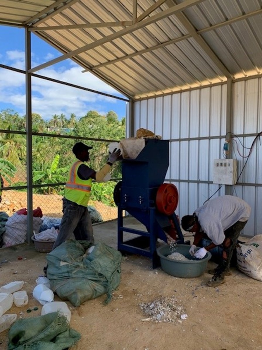 Shredding plastic in Samana, Dominican Republic to make it more marketable. 