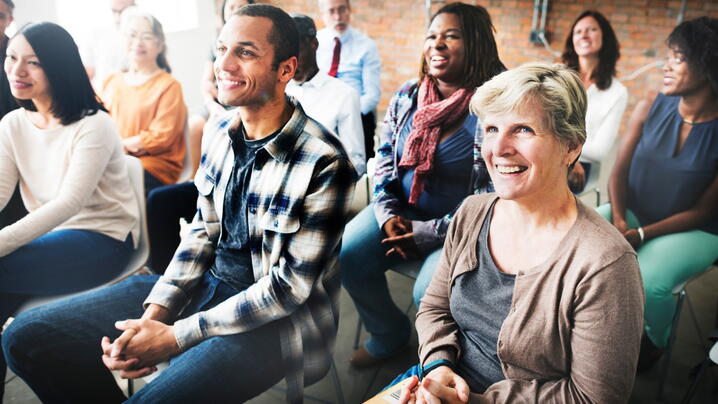 Image of people listening to a speaker