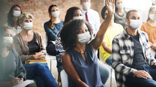 Photo of community members at a town hall meeting