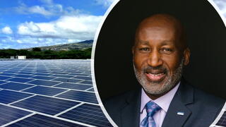 Headshot of Marc Ott along with a field of solar panels