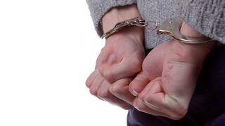 Image of hands in handcuffs